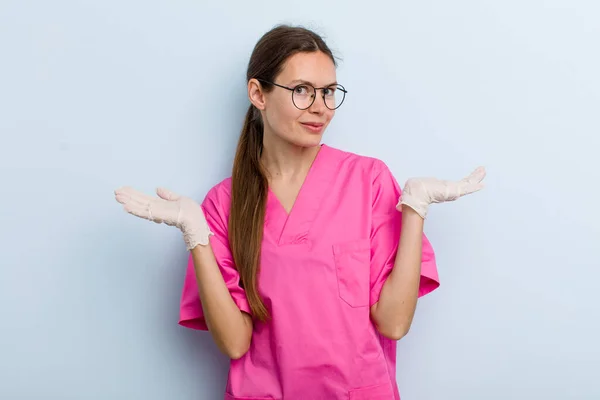 Young Adult Woman Feeling Puzzled Confused Doubting Nurse Concept — Stockfoto