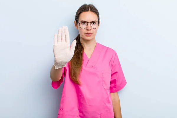 Young Adult Woman Looking Serious Showing Open Palm Making Stop — ストック写真