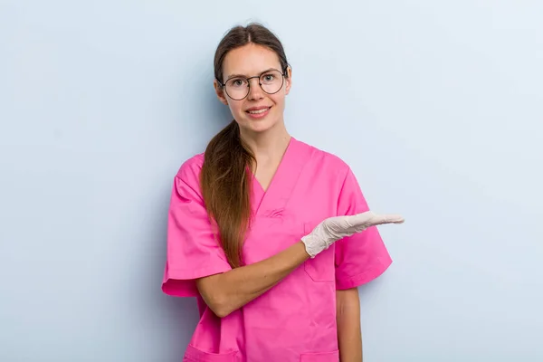 Young Adult Woman Smiling Cheerfully Feeling Happy Showing Concept Nurse — Zdjęcie stockowe