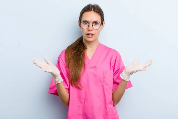 Young Adult Woman Feeling Extremely Shocked Surprised Nurse Concept — Stockfoto
