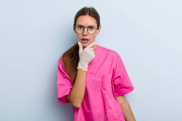 Young Adult Woman Mouth Eyes Wide Open Hand Chin Nurse — Foto Stock