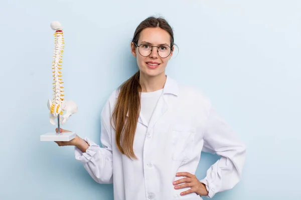 Young Adult Woman Smiling Happily Hand Hip Confident Spine Specialist — Stockfoto