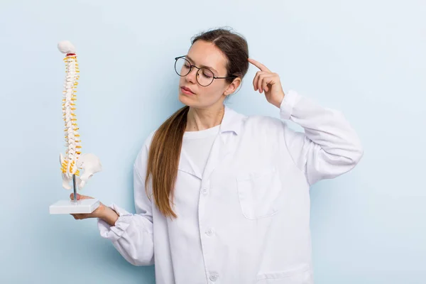 Young Adult Woman Smiling Happily Daydreaming Doubting Spine Specialist Concept — Stockfoto