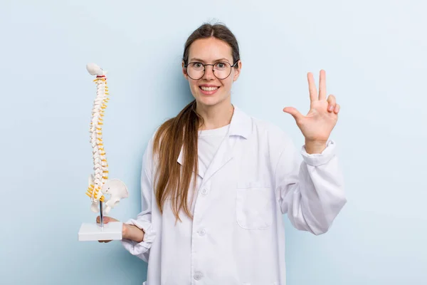 Young Adult Woman Smiling Looking Friendly Showing Number Three Spine — Stockfoto