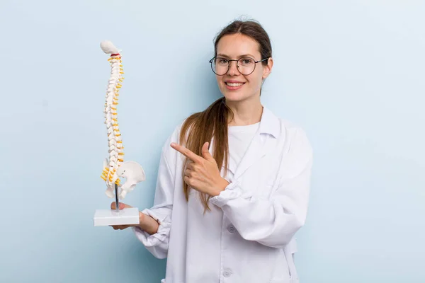 Young Adult Woman Smiling Cheerfully Feeling Happy Pointing Side Spine — Stockfoto