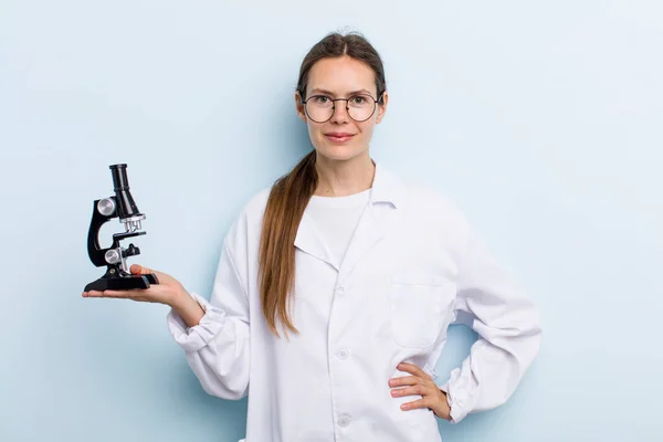 Young Adult Woman Smiling Happily Hand Hip Confident Scientist Microscope — Stockfoto