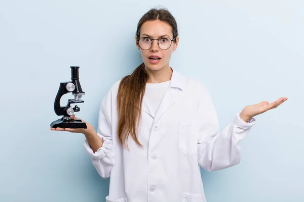 Young Adult Woman Feeling Extremely Shocked Surprised Scientist Microscope — Stok fotoğraf