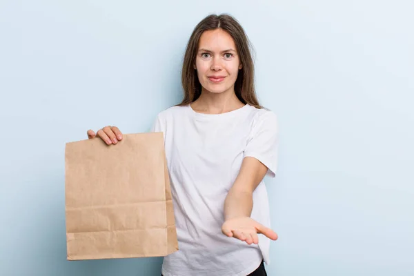 Young Adult Woman Smiling Happily Friendly Offering Showing Concept Delivery — ストック写真