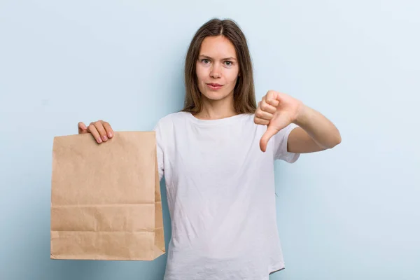 Young Adult Woman Feeling Cross Showing Thumbs Delivery Take Away — Stockfoto