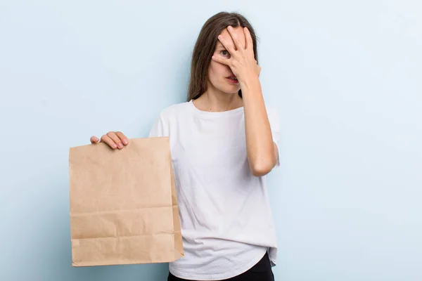 Young Adult Woman Looking Shocked Scared Terrified Covering Face Hand — Stockfoto