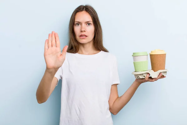 Young Adult Woman Looking Serious Showing Open Palm Making Stop — Stockfoto