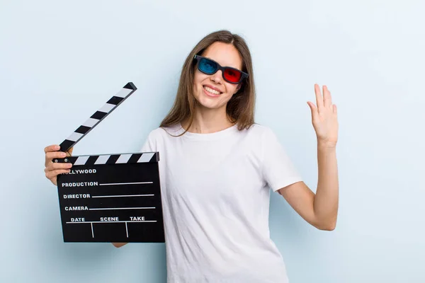 Young Adult Woman Smiling Happily Waving Hand Welcoming Greeting You — Stockfoto