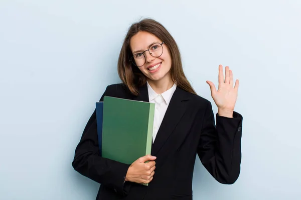 Young Adult Woman Smiling Happily Waving Hand Welcoming Greeting You — 图库照片