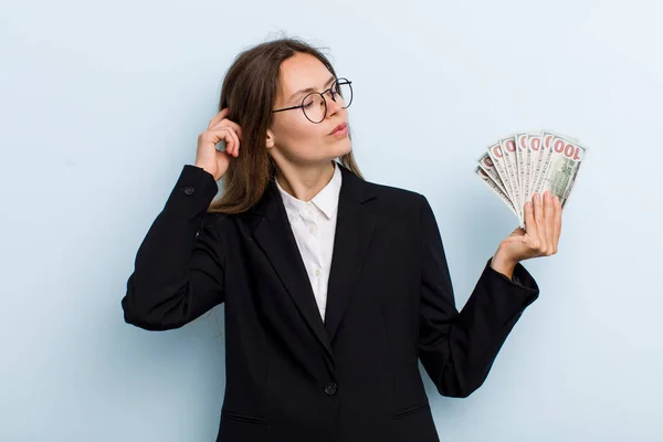 Young Adult Woman Feeling Puzzled Confused Scratching Head Dollar Banknotes — Stockfoto