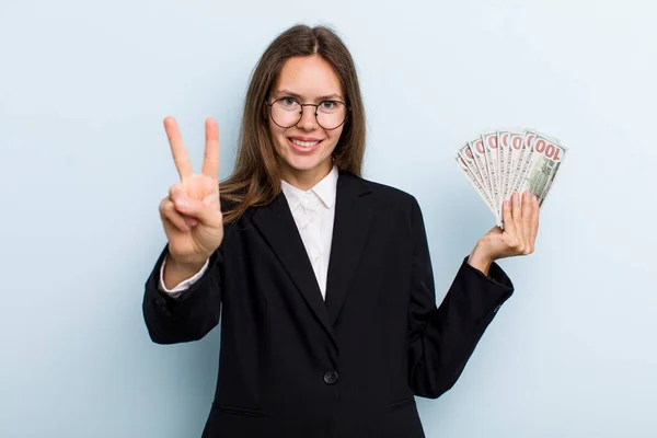 Young Adult Woman Smiling Looking Happy Gesturing Victory Peace Dollar — ストック写真