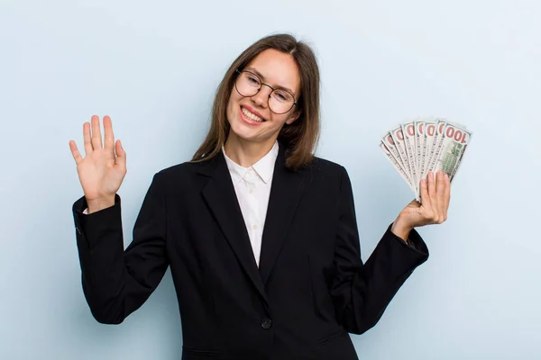 Young Adult Woman Smiling Happily Waving Hand Welcoming Greeting You — Stockfoto