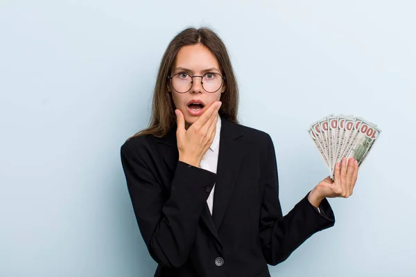 Young Adult Woman Mouth Eyes Wide Open Hand Chin Dollar — Stockfoto