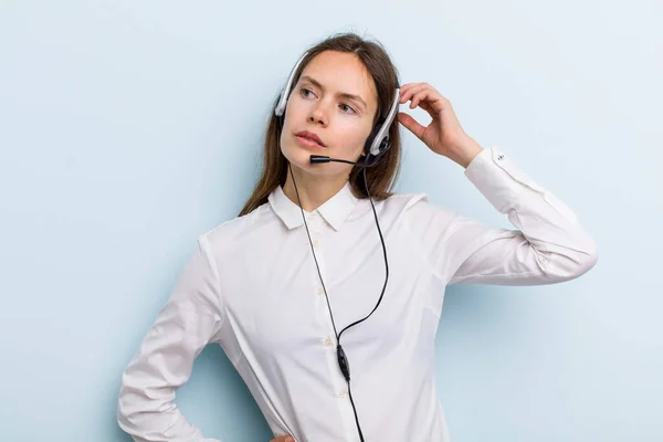 Young Adult Woman Feeling Puzzled Confused Scratching Head Telemarketer Concept — Stock Fotó