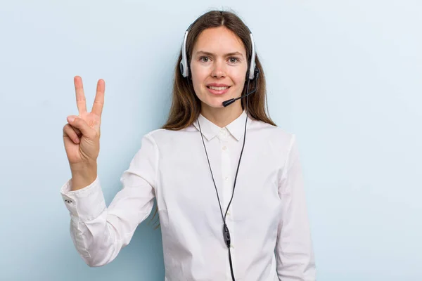 Young Adult Woman Smiling Looking Friendly Showing Number Two Telemarketer — Fotografia de Stock