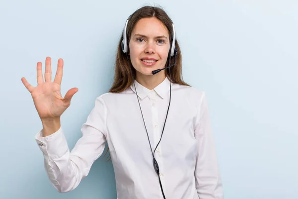 Young Adult Woman Smiling Looking Friendly Showing Number Five Telemarketer — Stockfoto