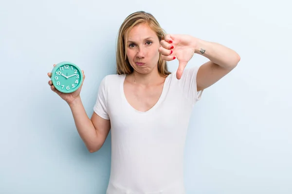 Blonde Young Adult Woman Feeling Cross Showing Thumbs Alarm Clock — Stock Fotó