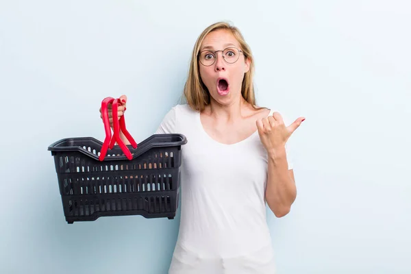 Blonde Young Adult Woman Looking Astonished Disbelief Shopping Basket — Stock Fotó
