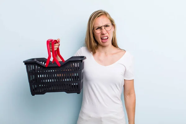 Blonde Young Adult Woman Feeling Puzzled Confused Shopping Basket — Foto Stock