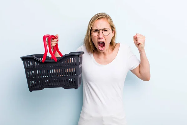 Blonde Young Adult Woman Shouting Aggressively Angry Expression Shopping Basket — Foto Stock