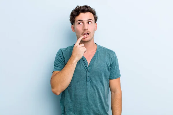 Young Handsome Man Surprised Nervous Worried Frightened Look Looking Side — Stock Photo, Image