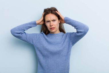 young adult pretty woman feeling frustrated and annoyed, sick and tired of failure, fed-up with dull, boring tasks
