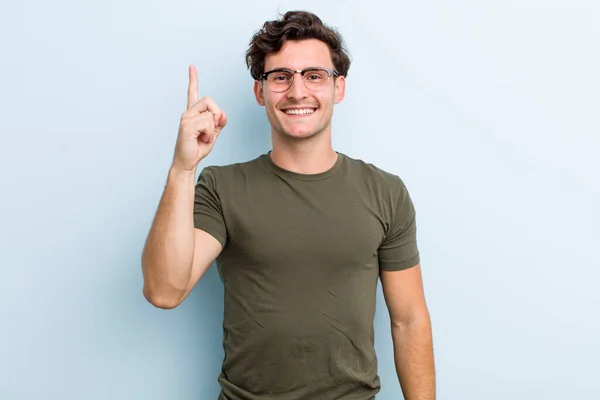 Young Handsome Man Smiling Cheerfully Happily Pointing Upwards One Hand — 图库照片