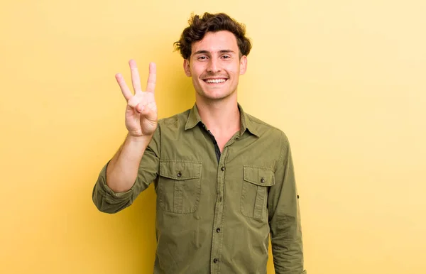 Jovem Bonito Homem Sorrindo Olhando Amigável Mostrando Número Três Terceiro — Fotografia de Stock