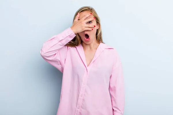 Young Adult Blonde Pretty Woman Looking Shocked Scared Terrified Covering — Foto Stock