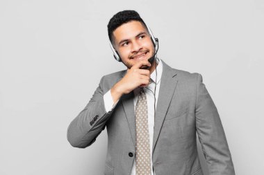 hispanic businessman thinking expression telemarketer concept