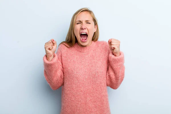 Young Adult Blonde Pretty Woman Shouting Aggressively Angry Expression Fists — ストック写真