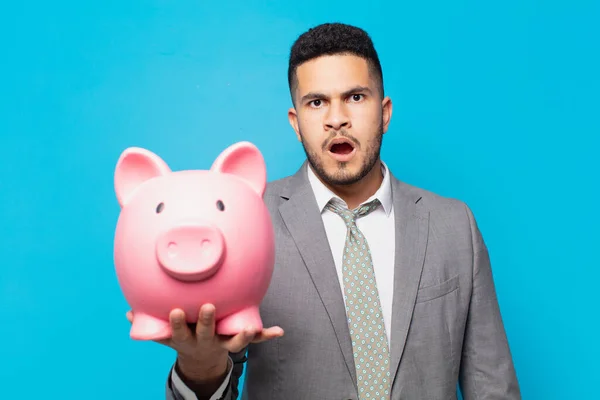 Hispanic Businessman Scared Expression Holding Piggy Bank — Stockfoto