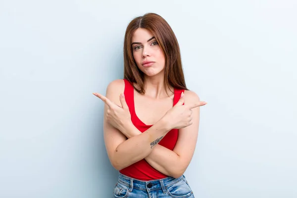 Young Adult Pretty Woman Looking Puzzled Confused Insecure Pointing Directions — Stockfoto