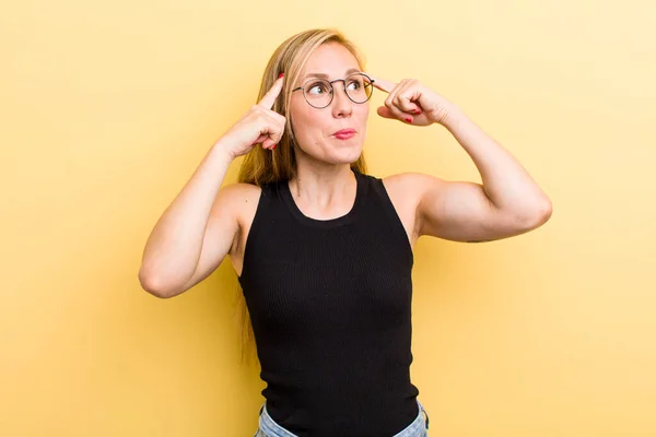 Young Adult Blonde Woman Feeling Confused Doubting Concentrating Idea Thinking — Stockfoto