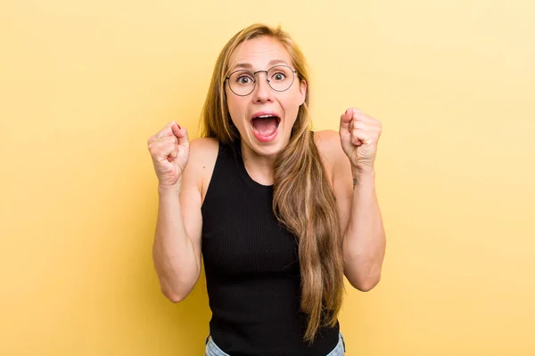 Young Adult Blonde Woman Feeling Shocked Excited Happy Laughing Celebrating — Foto Stock