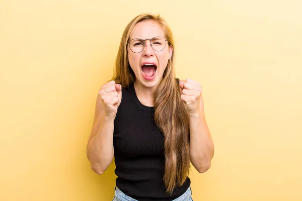 Young Adult Blonde Woman Shouting Aggressively Annoyed Frustrated Angry Look — Stockfoto