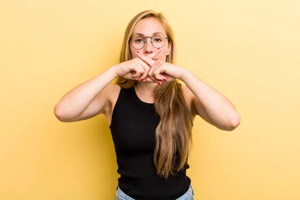 Young Adult Blonde Woman Looking Serious Displeased Both Fingers Crossed — Stockfoto