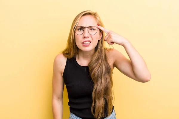 Young Adult Blonde Woman Feeling Confused Puzzled Showing You Insane — Stockfoto