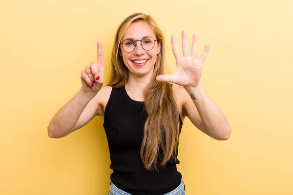 Young Adult Blonde Woman Smiling Looking Friendly Showing Number Six — Foto Stock