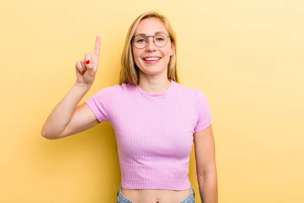 Young Adult Blonde Woman Smiling Cheerfully Happily Pointing Upwards One — Foto Stock