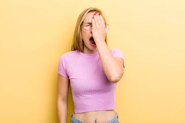 Young Adult Blonde Woman Looking Sleepy Bored Yawning Headache One — Zdjęcie stockowe