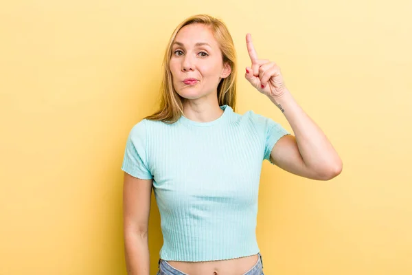 Young Adult Blonde Woman Feeling Genius Holding Finger Proudly Air — 스톡 사진