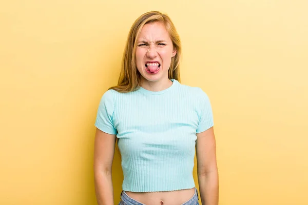 Young Adult Blonde Woman Feeling Disgusted Irritated Sticking Tongue Out — Stockfoto