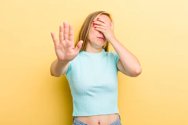 Young Adult Blonde Woman Covering Face Hand Putting Other Hand — Foto de Stock