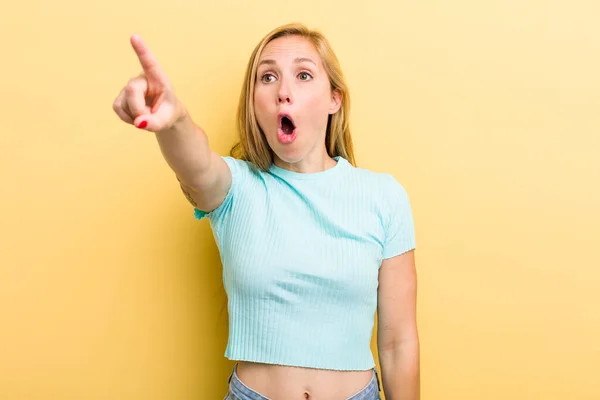 Young Adult Blonde Woman Feeling Shocked Surprised Pointing Looking Upwards — Stock fotografie