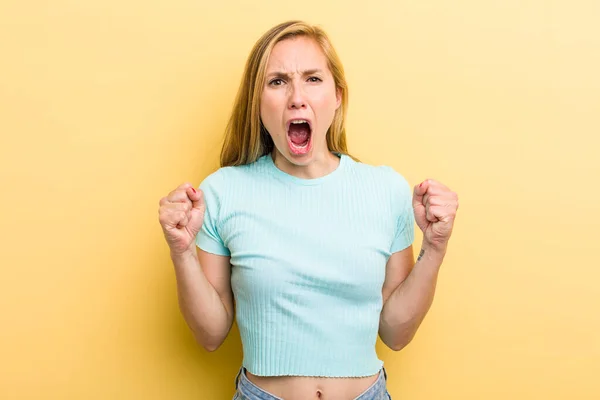 Young Adult Blonde Woman Shouting Aggressively Angry Expression Fists Clenched — 图库照片
